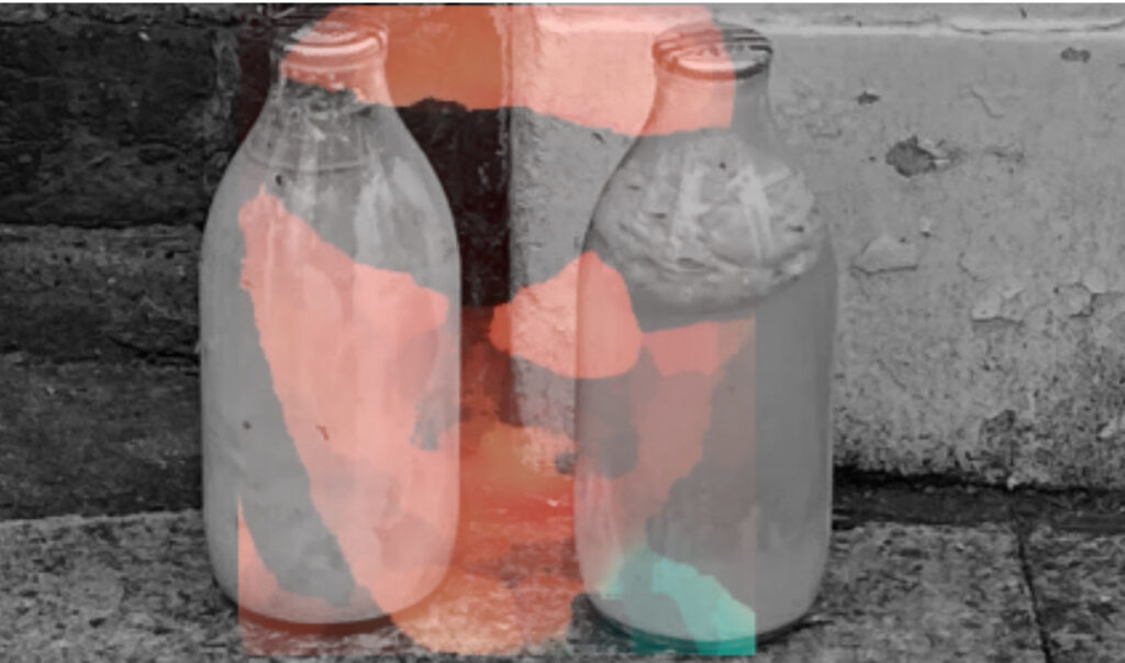 2 pints of curdled milk overlaid with a semi-opaque pic of Doc Swallow wearing a bike helmet and sun glasses