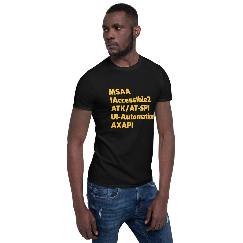 Black bloke wearing a black shirt. Printed message on shirt yellow text: MSAA IAccessible2 ATK/AT-SPI UI-Automation AXAPI